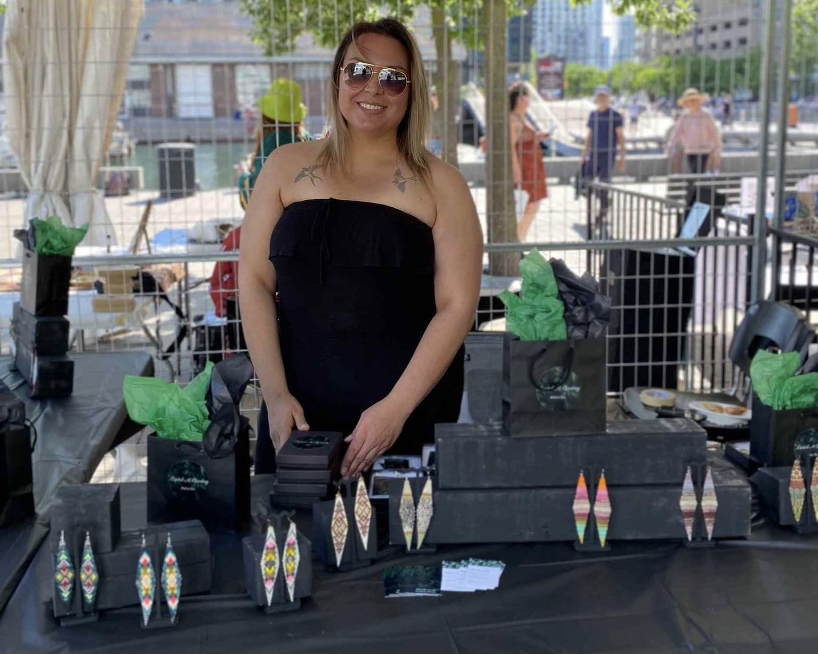 Mishelle Lavoie at her booth at the 2022 Indigenous Fashion Arts Festival. With permission from Mishelle Lavoie.