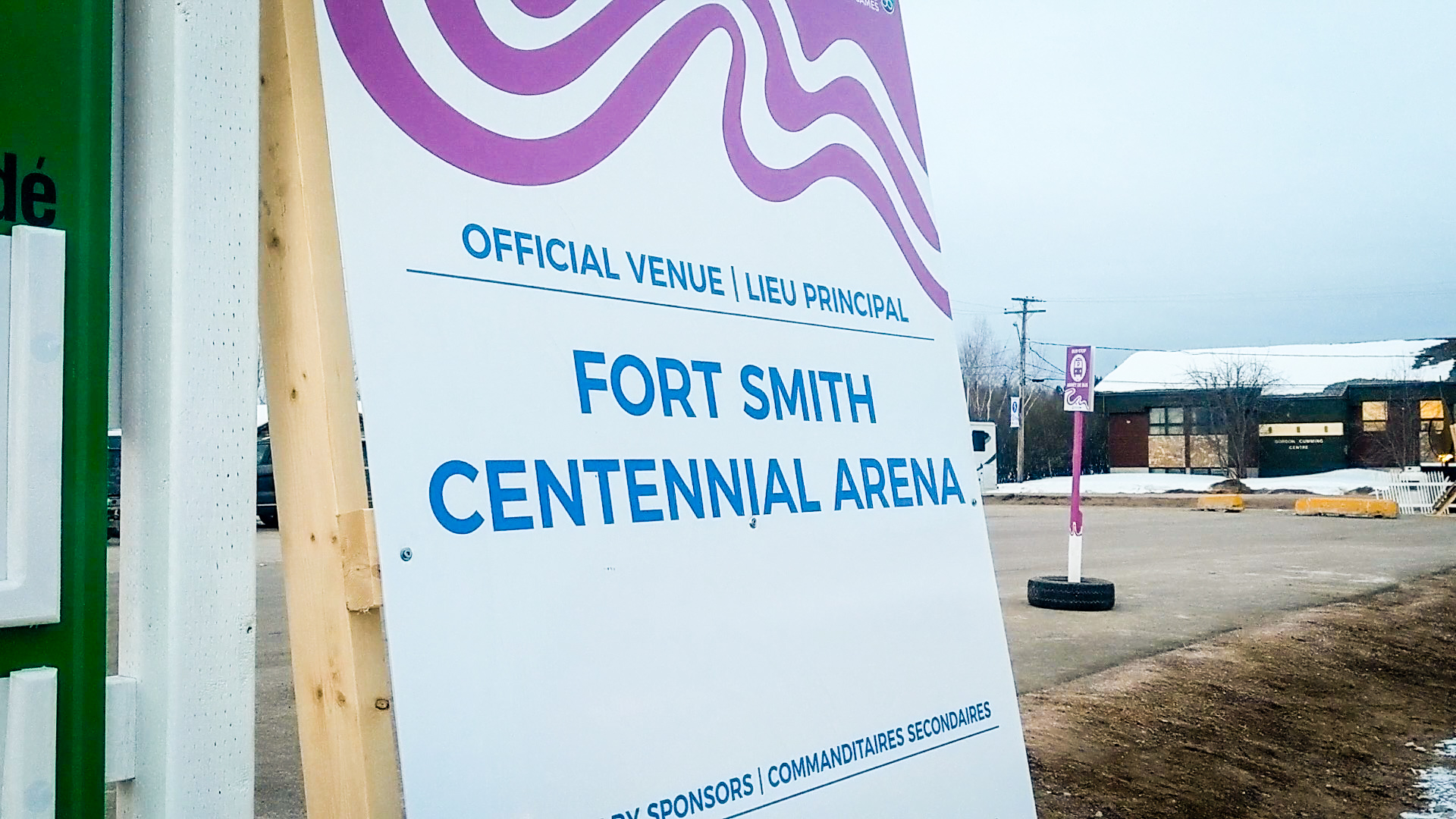 A large sign welcomes visitors to Fort Smith's Centennial Arena for the Arctic Winter Games