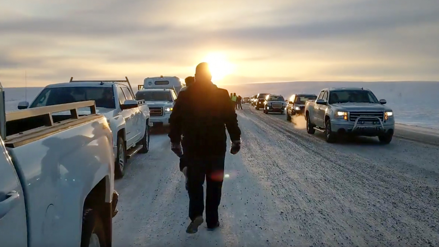 Attendees gather on the Inuvik-Tuk highway during an inaugural procession along the road on its opening day in November 2017