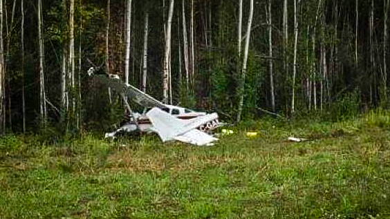An aircraft is shown at rest in Nahanni Butte following a crash in August 2018
