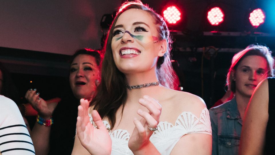 Members of the Queerlesque cast and audience react with delight as the wedding of Dee Fowler and Manda Fahy begins