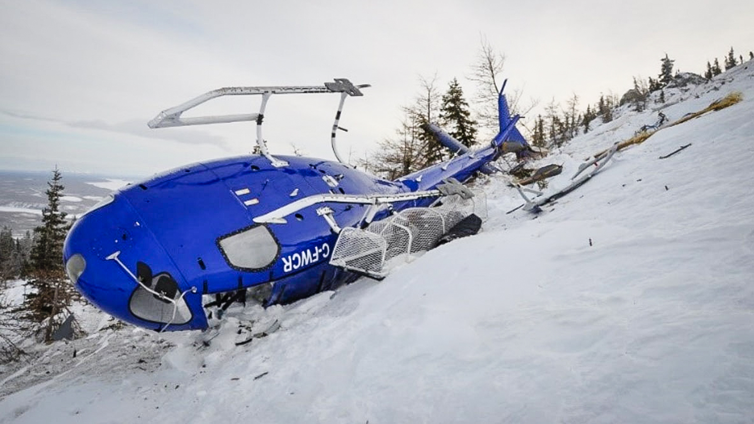 A photograph provided to the Transportation Safety Board of Canada by Great Slave Helicopters shows a downed helicopter in February 2018