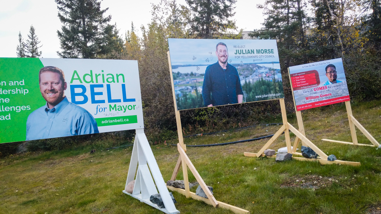 Vandalized election signs on Yellowknife's Franklin Avenue in September 2018
