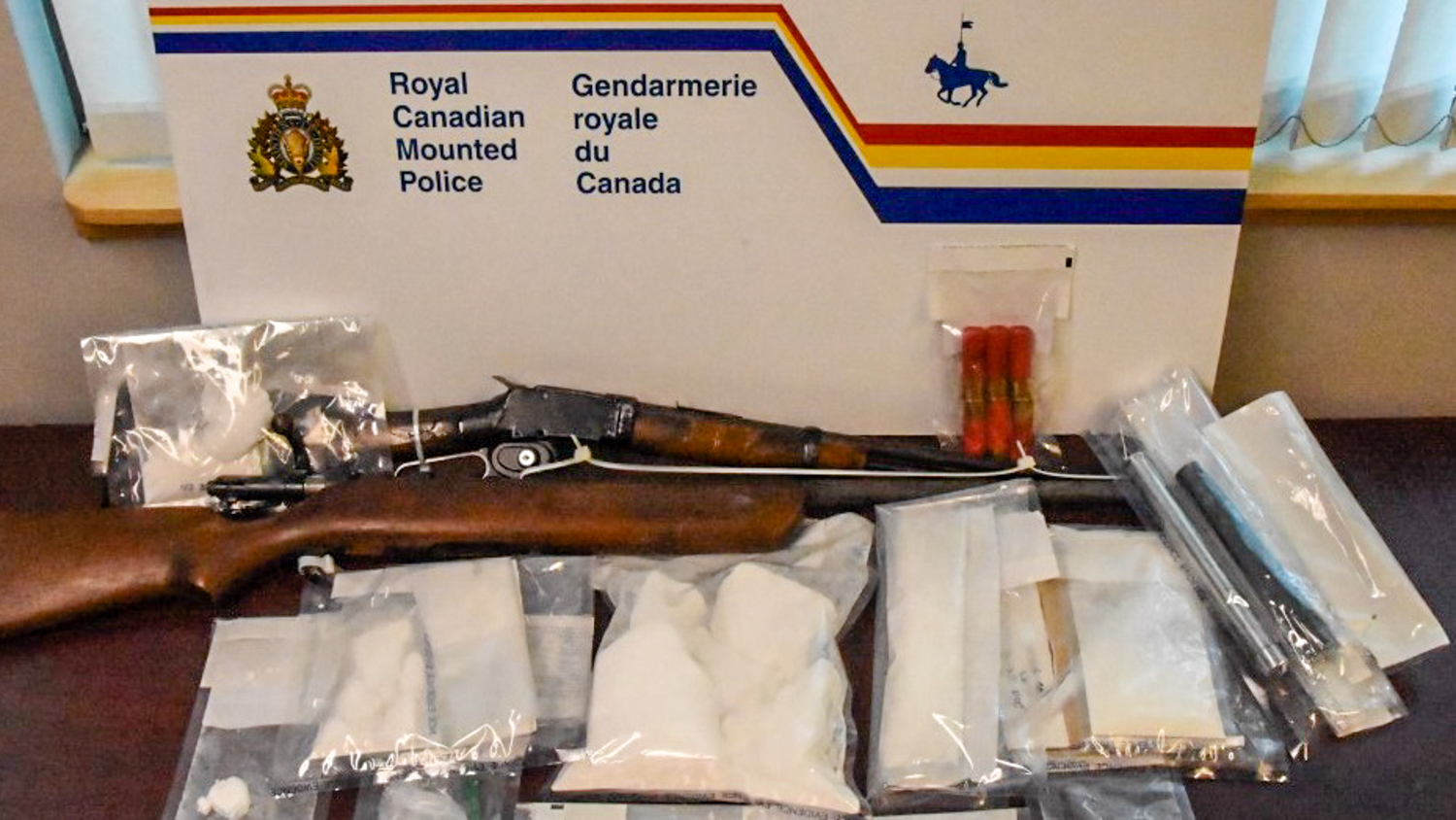 An RCMP handout image of a firearm and drugs seized during Project Gloomiest