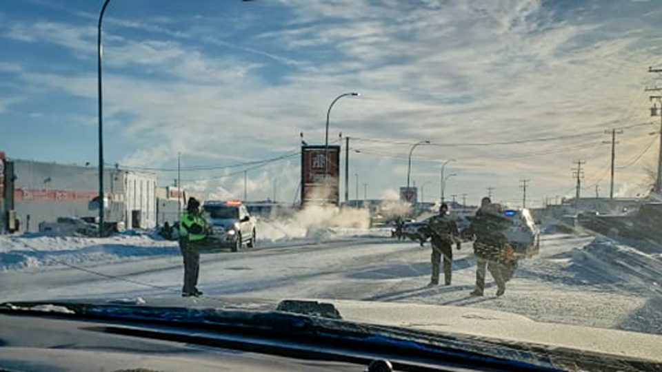 Police officers are seen on Old Airport Road on January 28, 2019