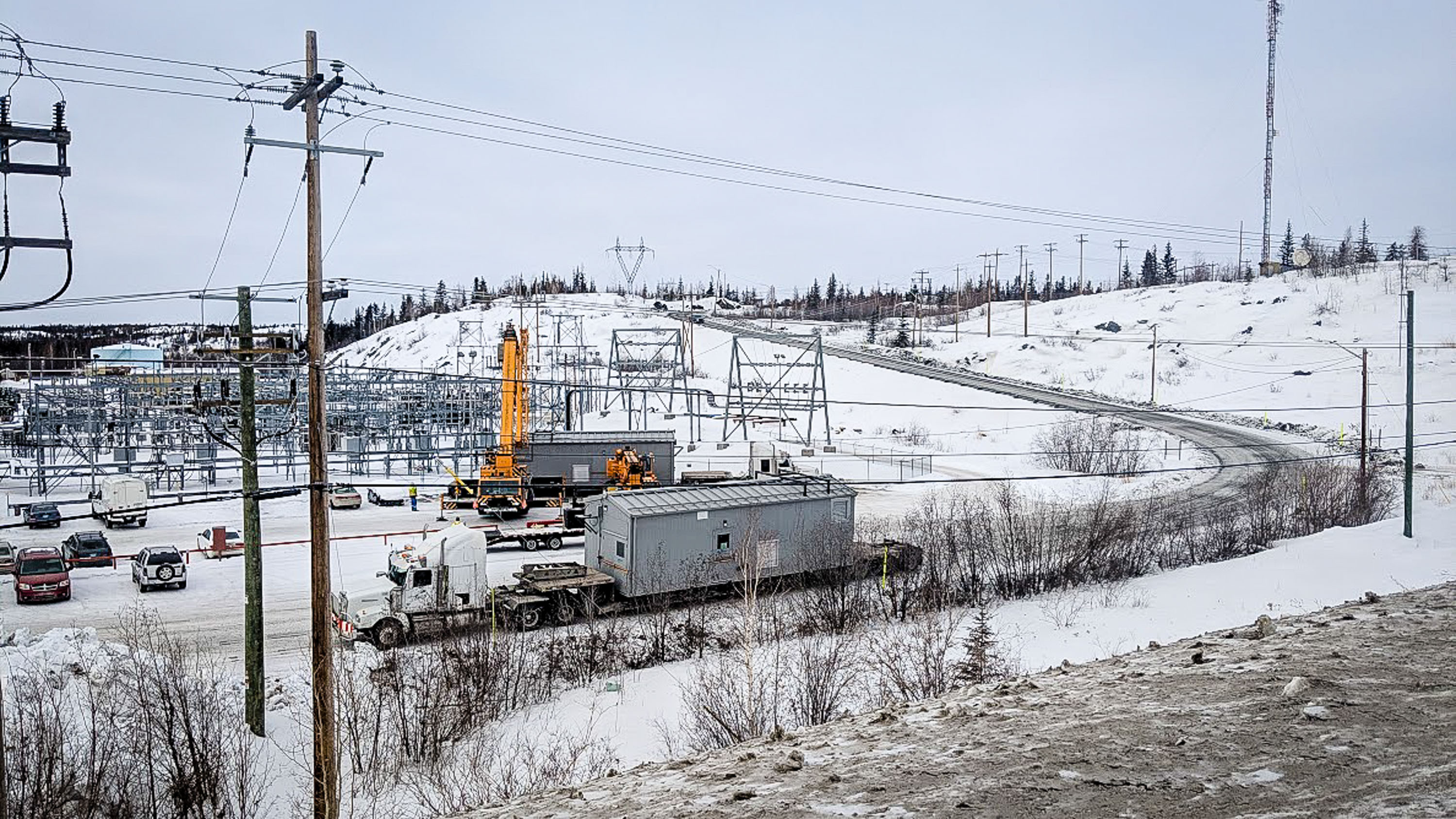 Modular diesel generators, in grey, can be seen being lifted into place at the Jackfish power plant on March 8, 2019