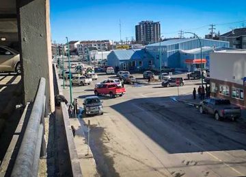 Emergency services line up outside Yellowknife's day shelter and sobering centre on April 9, 2019