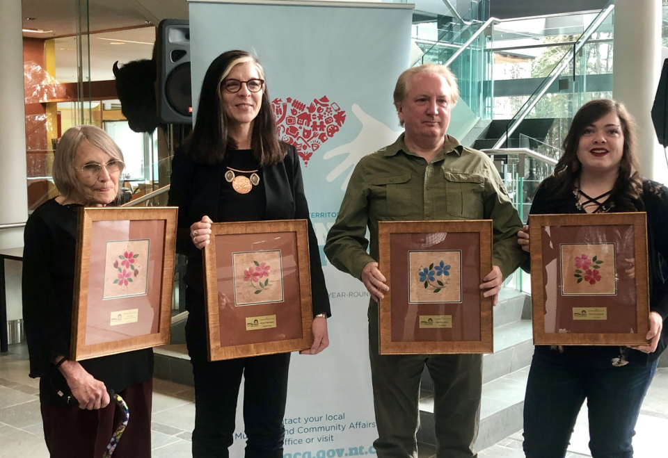 The four winners of 2019's Outstanding Volunteer Awards pose at the legislature