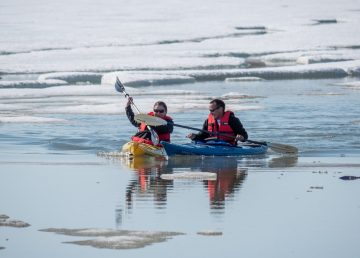 Kayakers head out for a paddle during Sachs Harbour's Oceans Day in July 2019. Inuvialuit Regional Corporation photo