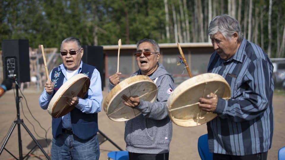 The Kátł’odeeche First Nation Drummers, lead by Joe Tambour, centre, open at the RCMP Musical Ride. Sarah Pruys/Cabin Radio