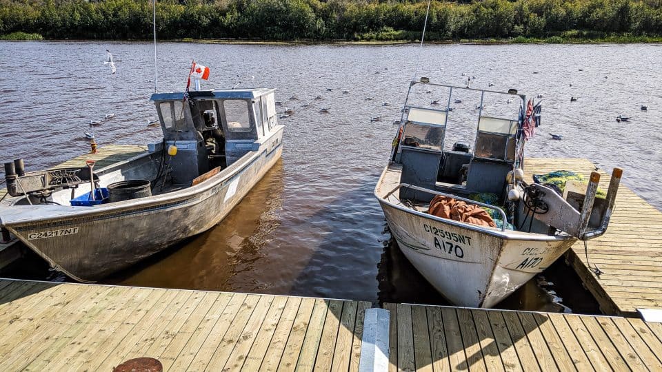 Fishing boats on the Hay River in August 2019