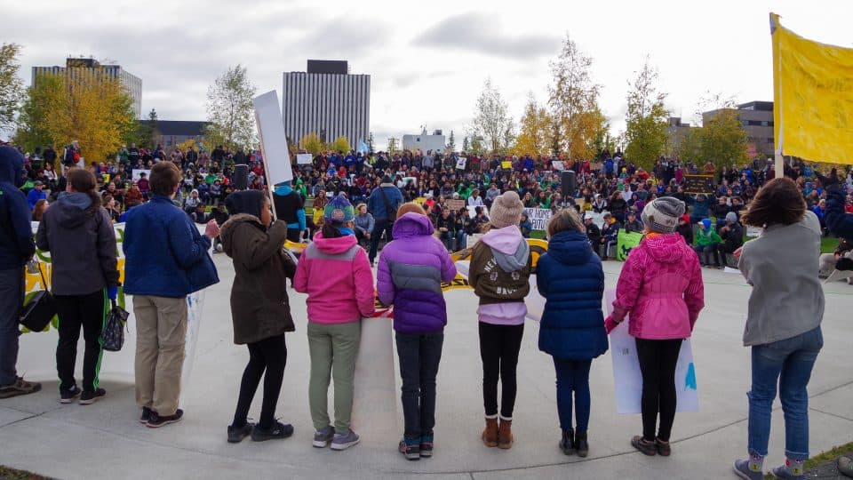 Speakers address the global climate strike crowd at Yellowknife's Somba K'e Park