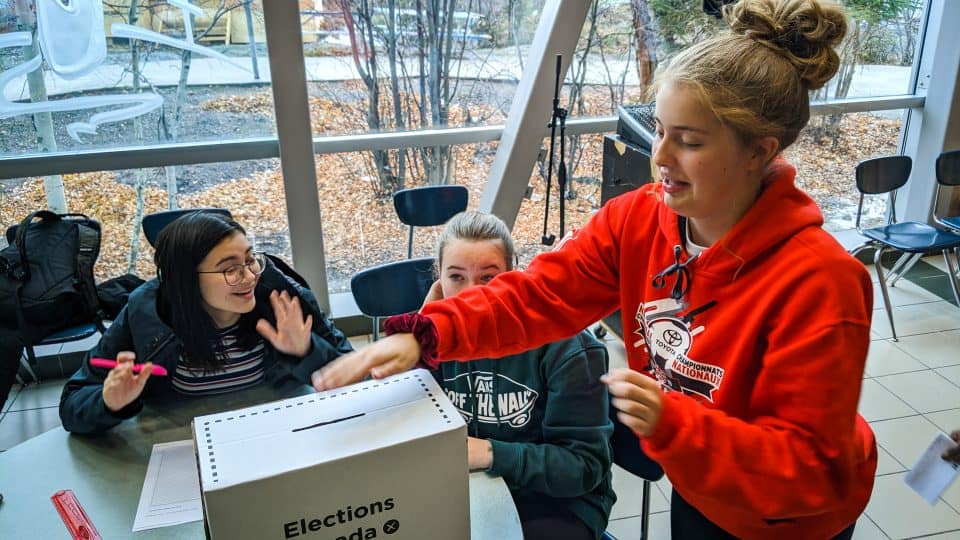 A St Pat's high school student casts a vote in a mock federal election on October 18, 2019