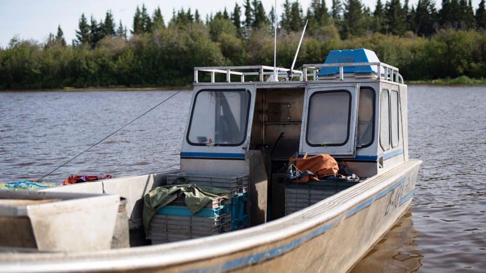 A fishing boat docked in Hay River in August 2019. Sarah Pruys/Cabin Radio