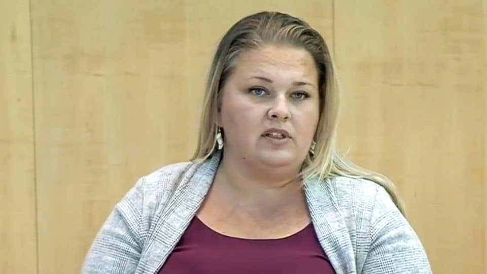 Caitlin Cleveland addresses the legislature in October 2019