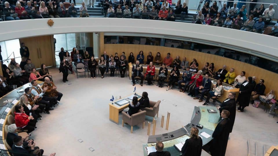 MLAs, friends, and family members gather in the legislature in October 2019