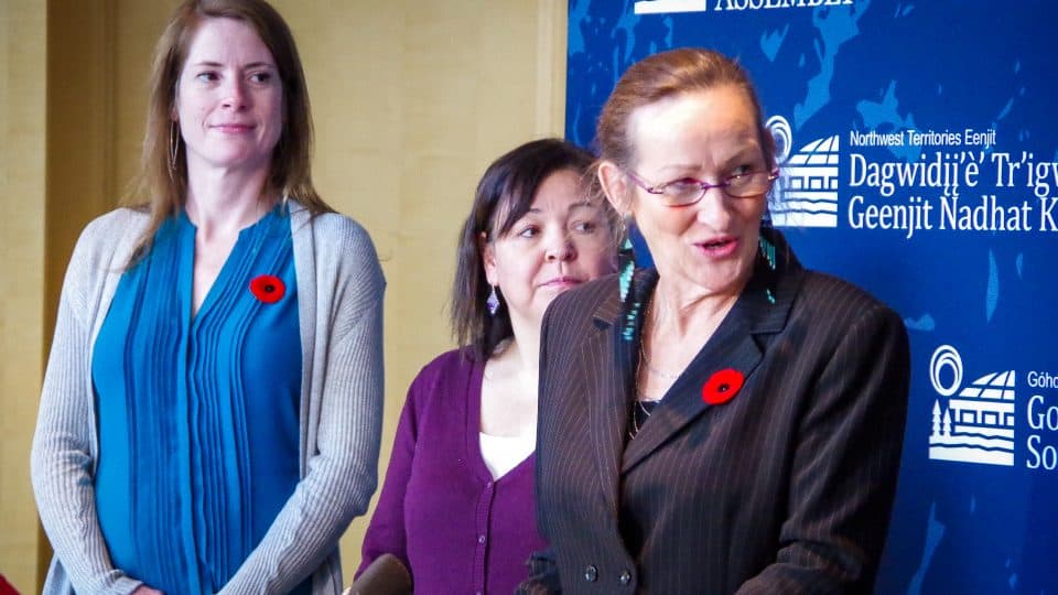 Premier Caroline Cochrane, flanked by cabinet members, holds her first formal news conference since becoming premier