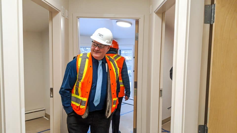 Tom Williams inspects rooms at the renovated Yellowknife emergency women's shelter
