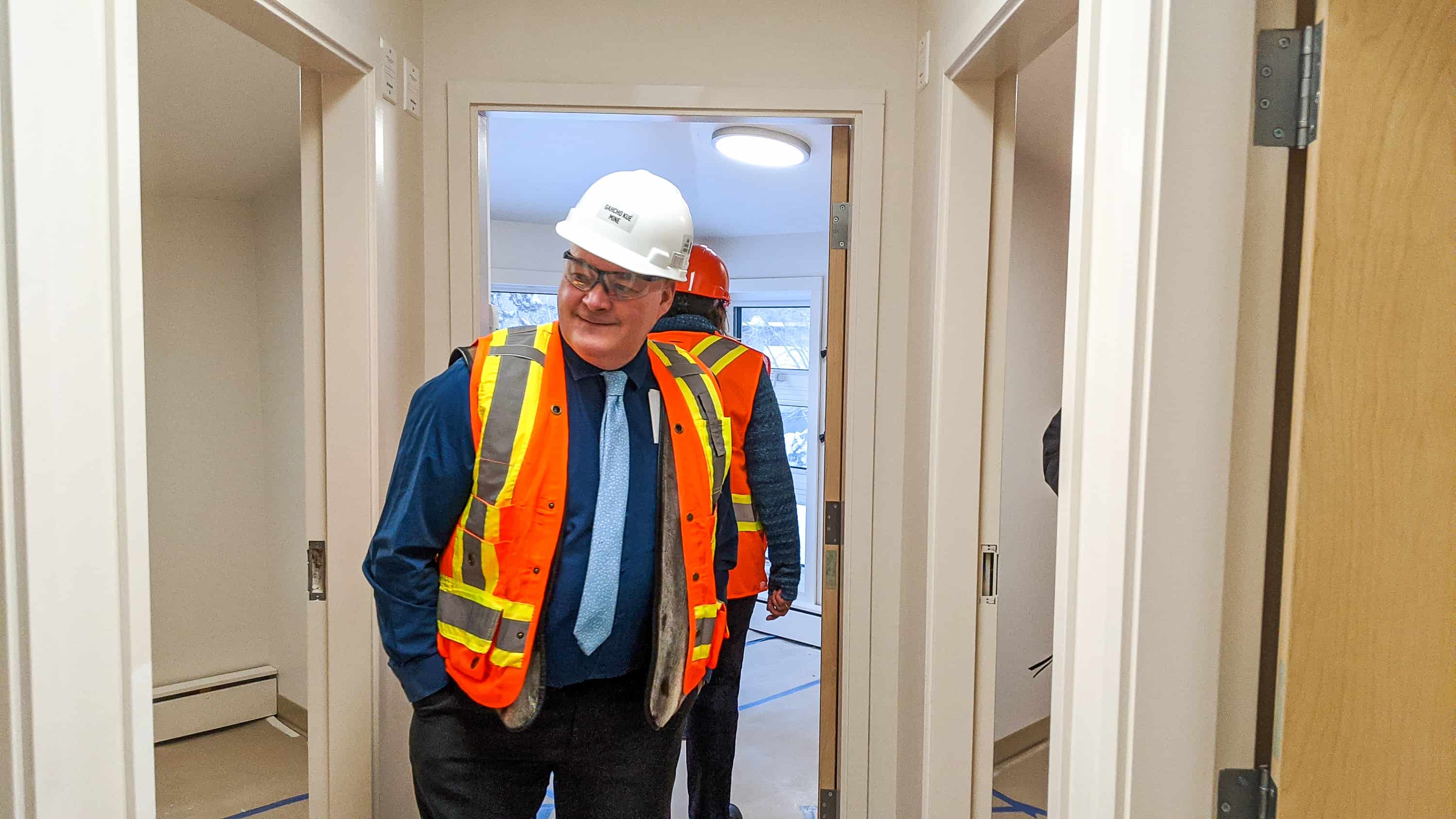 Tom Williams inspects rooms at the renovated Yellowknife emergency women's shelter
