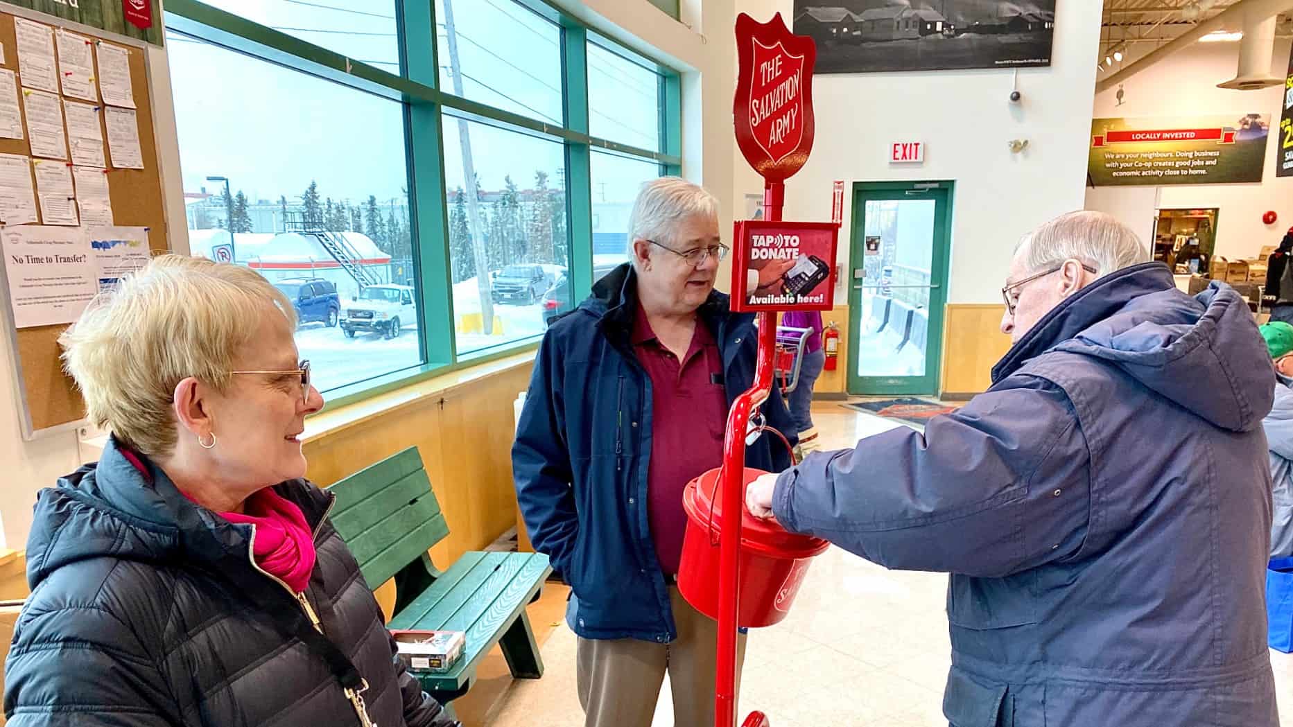Rotary Club of Yellowknife member Brian George, and Debra George, volunteer at a kettle at the Yellowknife Co-op