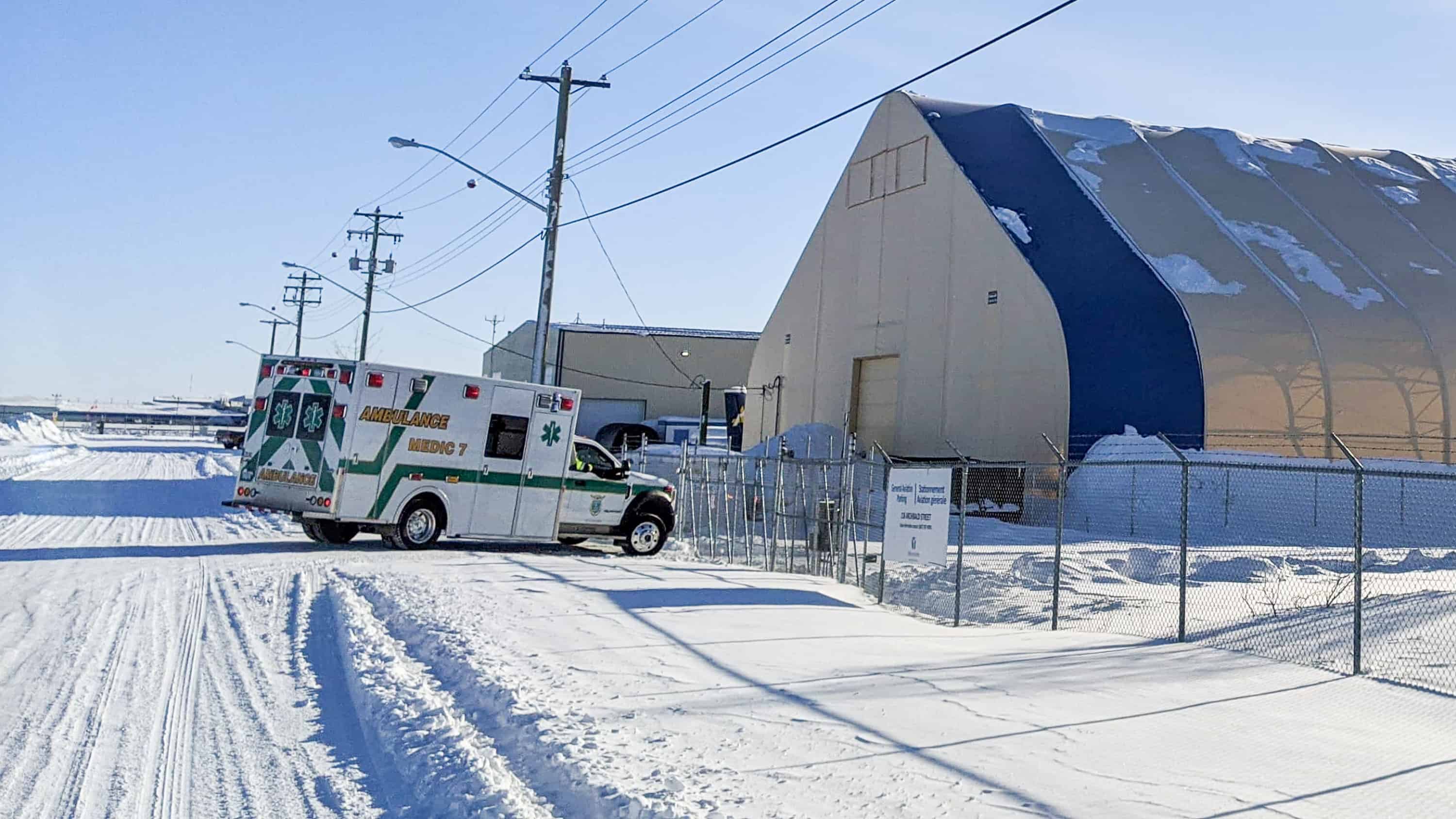 An ambulance waits outside a hangar near Yellowknife Airport on February 18, 2020