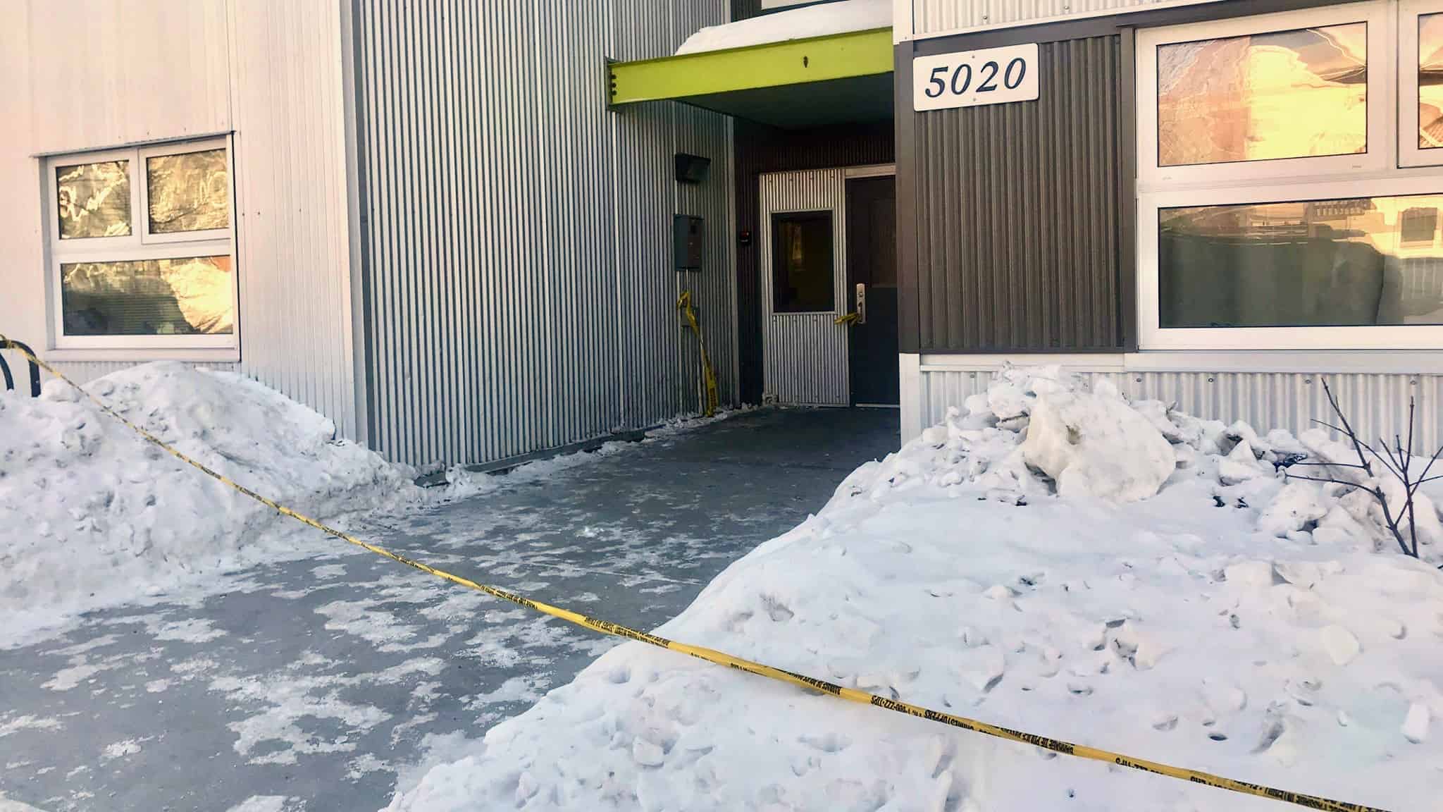 Police tape outside an apartment building on Yellowknife's 53 Street on March 31, 2020