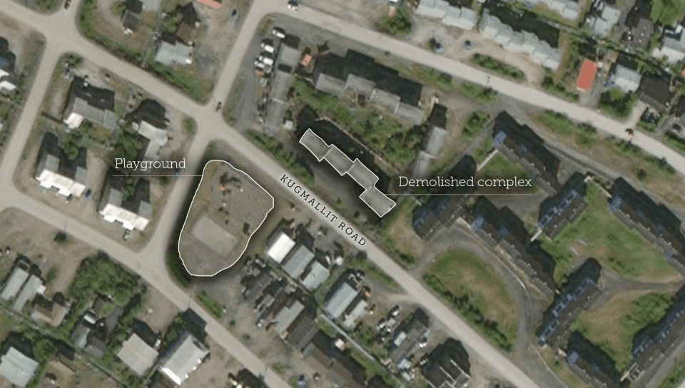 A playground, centre left, is seen opposite apartment buildings – one of which burned down on Saturday – in a satellite image of Inuvik's Kugmalit Road