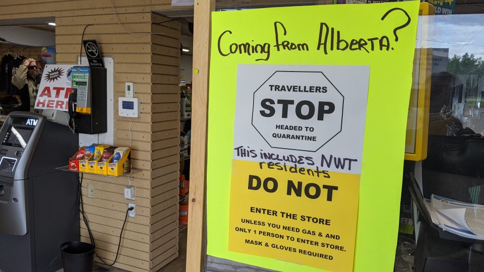 A sign at Big River gas station warns travellers to quarantine and not enter the store if coming from Alberta