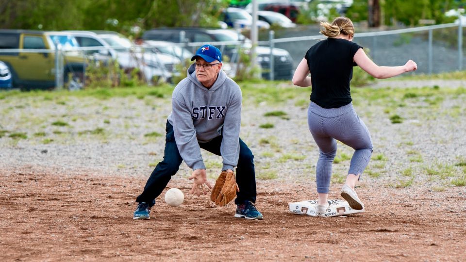 Gerard Landry playing baseball for a team of teachers against students in 2019