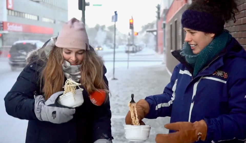 Sarah Sibley, left, and Meaghan Brackenbury with noodles during a slightly chilly December Yellowknife day