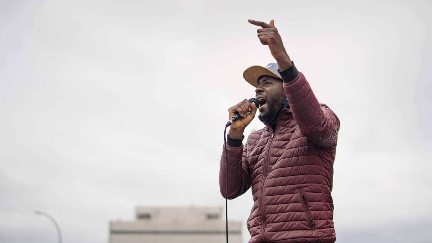 Ambe Chenemu speaks at a Black Lives Matter demonstration in Yellowknife in July 2020. Sarah Pruys/Cabin Radio