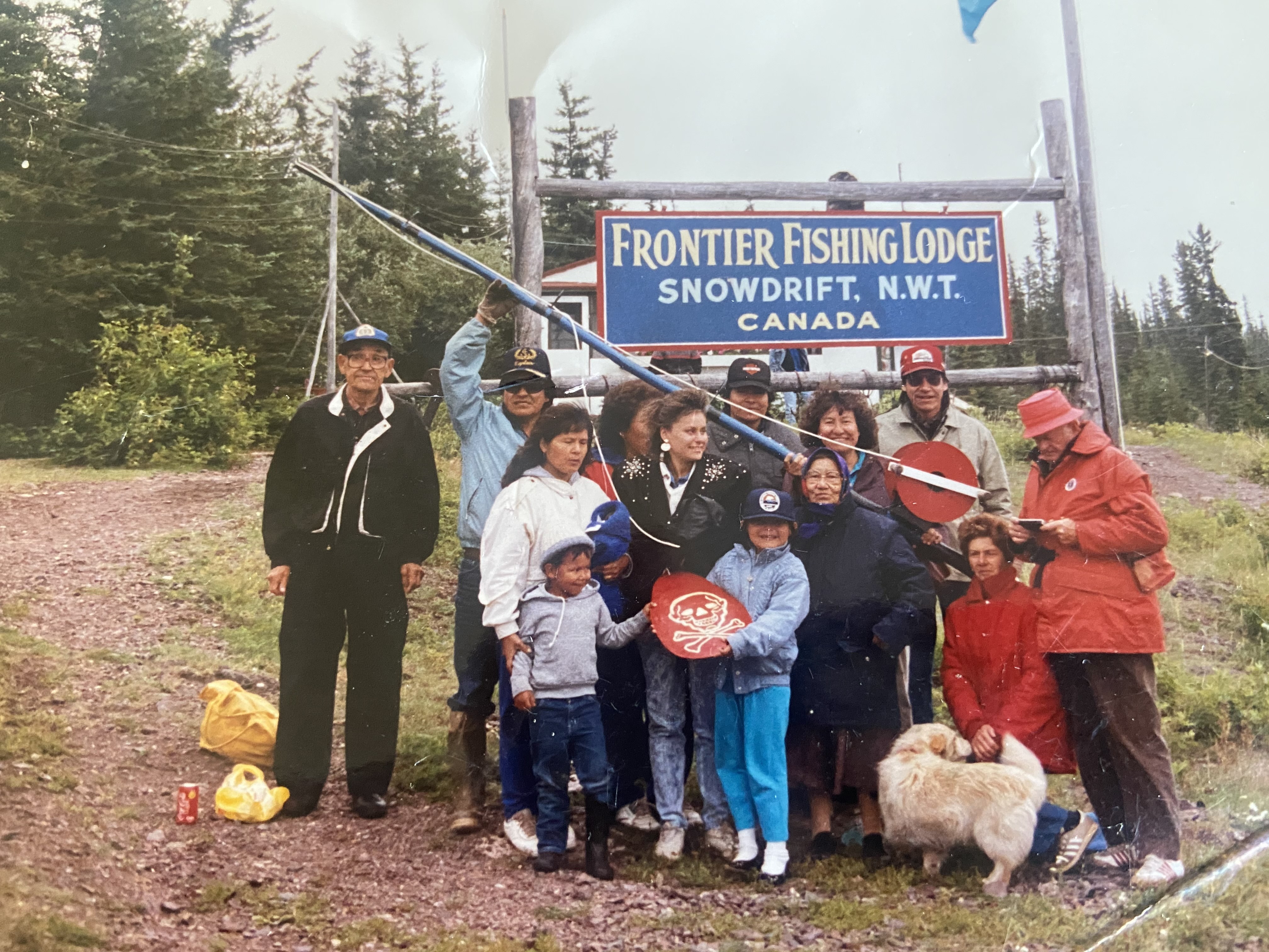 A photo from Shawna Yamkovy’s family visit to the community of Łútsël K'é, then named Snowdrift, with Yamkovy in the middle wearing a black coat