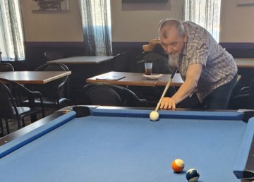 Roman ‘Ron’ Rosnawski playing pool in a submitted photo.
