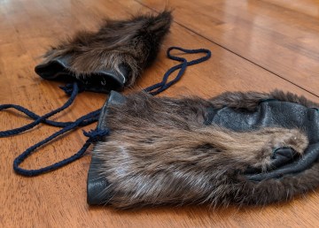 A file photo of beaver fur mittens. Sarah Pruys/Cabin Radio