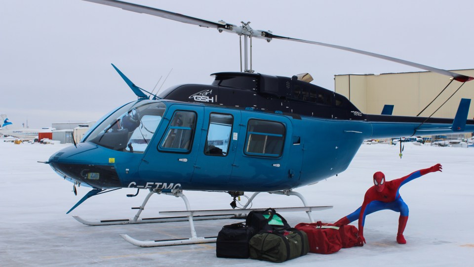 Spider-Man disembarks from a helicopter in Detta