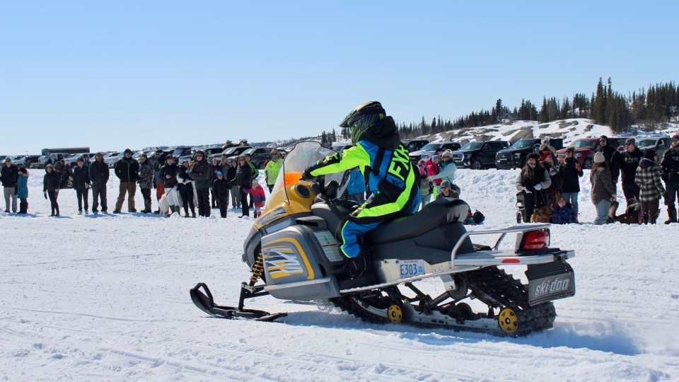 Snowmobile drag racing on Yellowknife Bay on April 23, 2022
