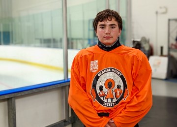 Jude Brothers wears an Orange Jersey Project jersey