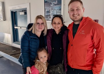 From left: Anastasia, Solomia, Varvara and Andrii at Fort Simpson's airport