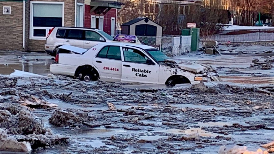 A cab hit by floodwater in Hay River