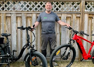 Steve Charron with two e-bikes
