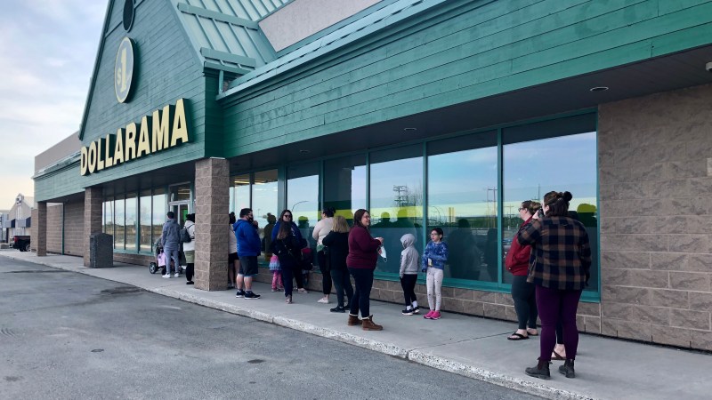 A crowd begins to form outside Yellowknife's Dollarama on its opening day.