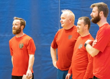 Warrant Officer Michael May, left, with members of the victorious Canadian Rangers dodgeball team