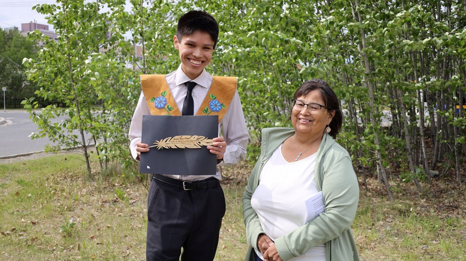 Jaylen Base-Smith accepts one of the inaugural Sacred Feather Indigenous Student Awards from YK1. Credit: Yellowknife Education District No. 1