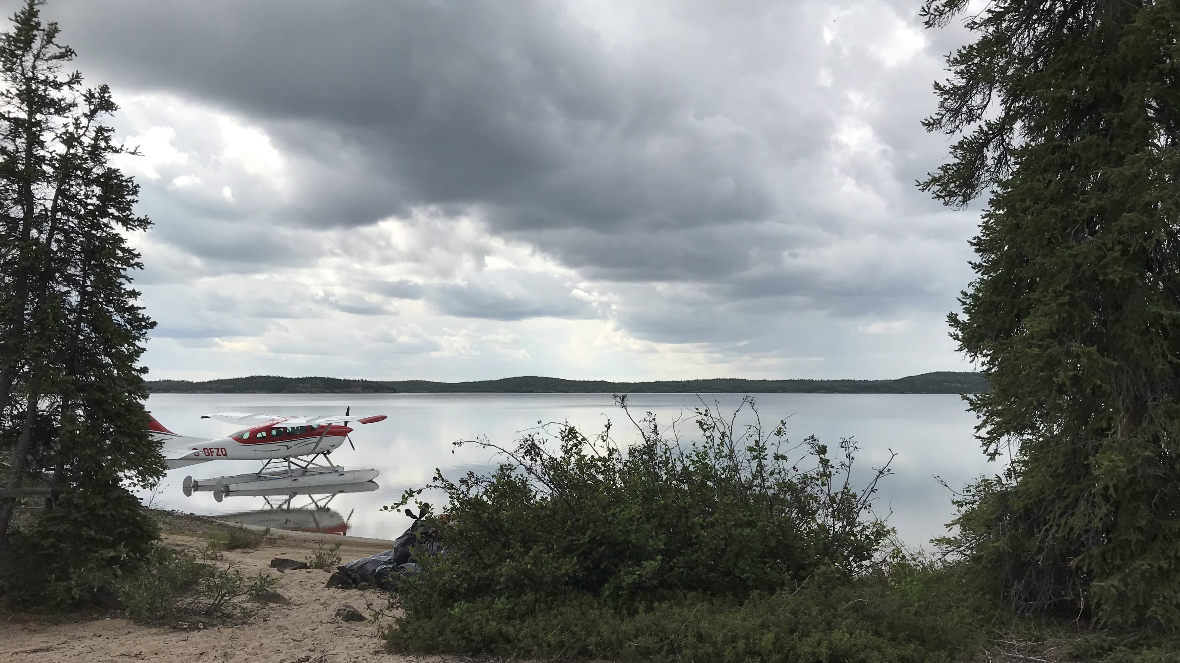 A plane waits at the Pensive Lake campsite to fly garbage back to Yellowknife