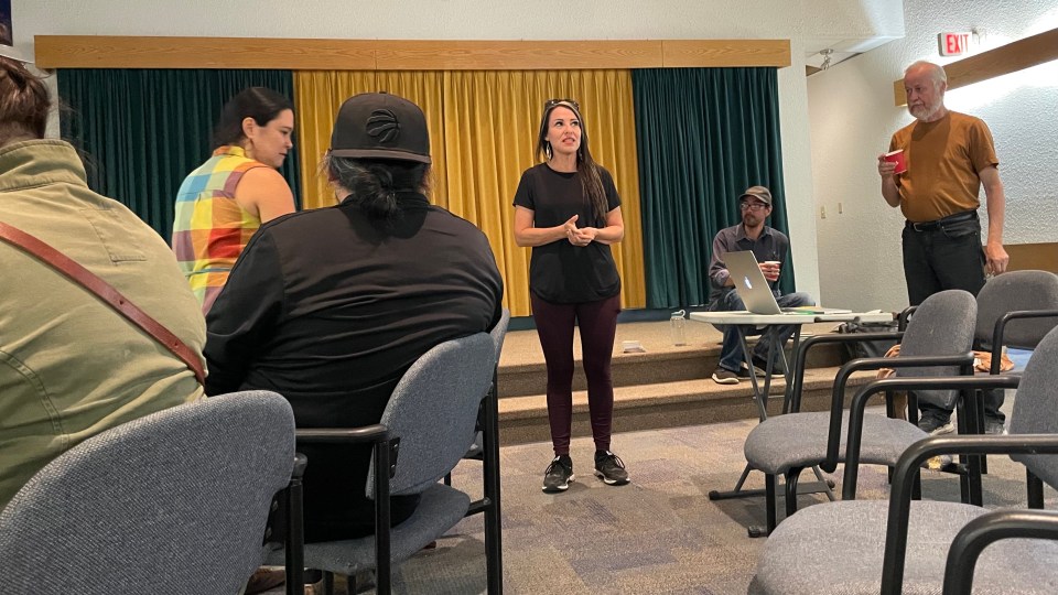 Jesse Cardinal (left), Daniel T'seleie (centre), and Paul Belanger from Keepers of the Water give a presentation at Northern United Place in Yellowknife
