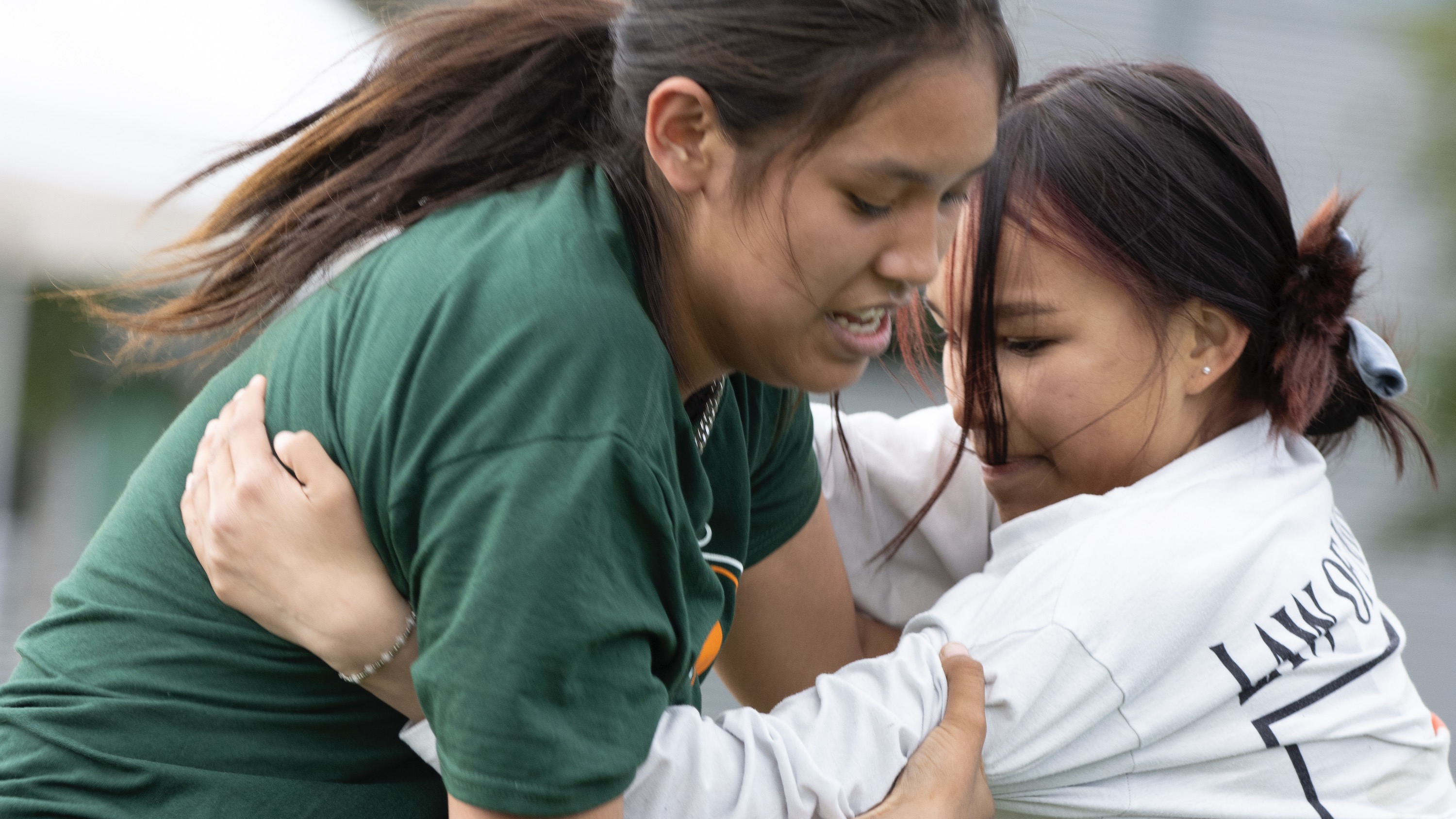 Two athletes face off in the Dene wrestling women's junior competition on the opening day of the 2022 NWT Indigenous Summer Games