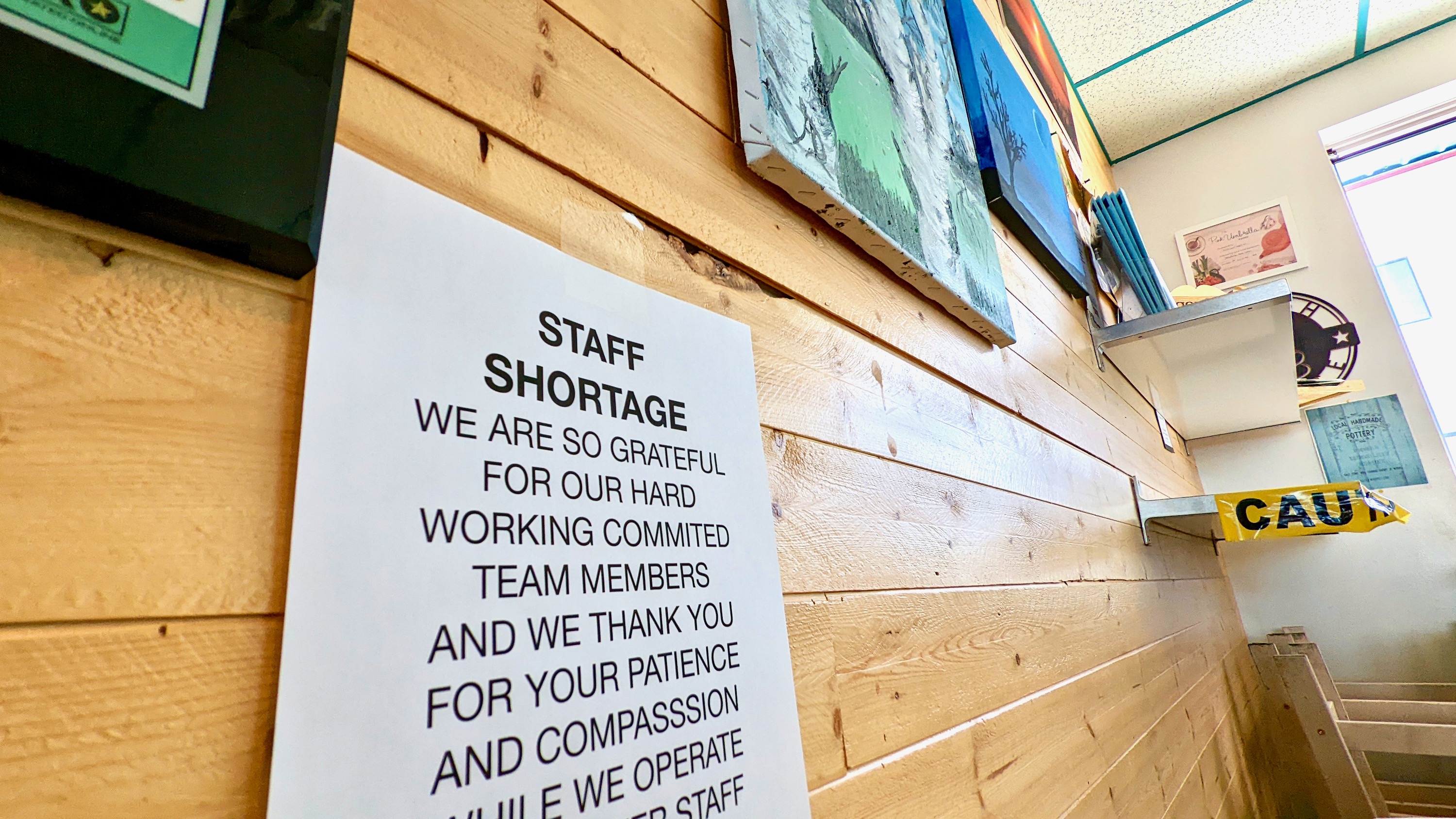 A sign at Yellowknife's Birchwood Coffee Kǫ̀ in August 2022 informs customers of a staff shortage