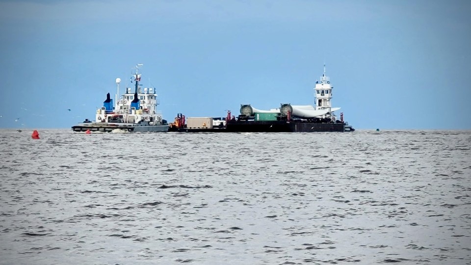 A photo posted to Facebook by Lynn Lepine shows barges on the water outside Hay River