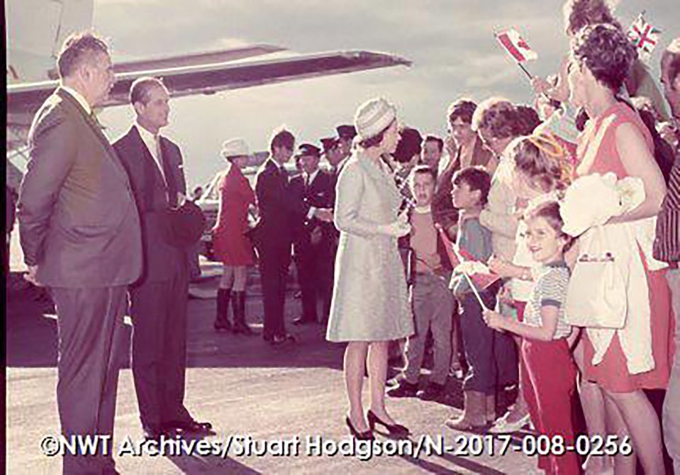 Queen Elizabeth II greets crowds on the tarmac
