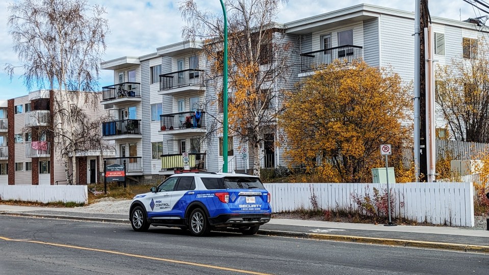 A Risk Control Security vehicle parked outside a Yellowknife housing block